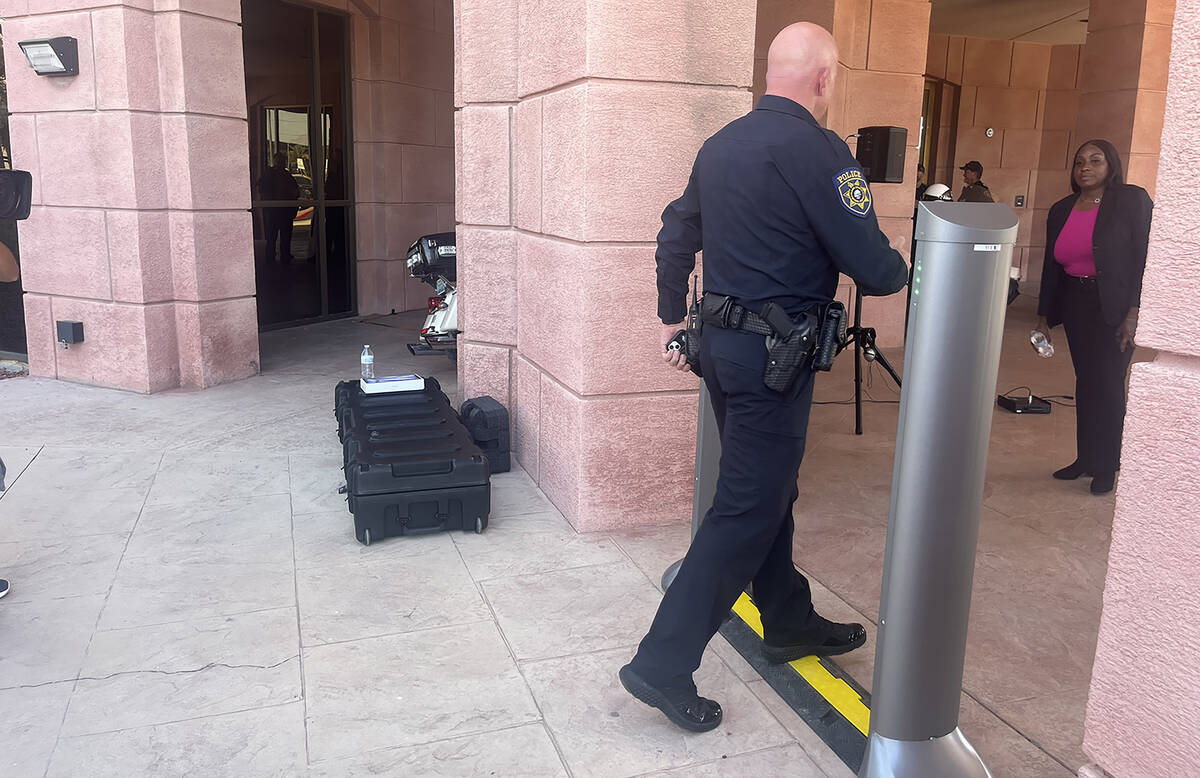 Clark County School District Police Department Lt. Bryan Zink tests a new weapons detection sys ...