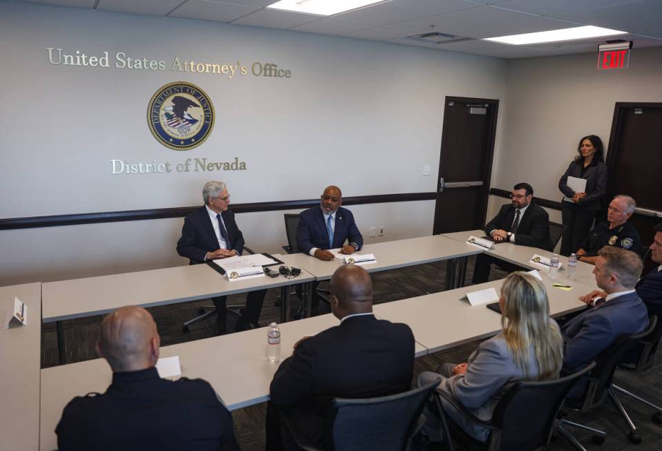 U.S. Attorney Jason Frierson, right, speaks next to U.S. Attorney General Merrick Garland, left ...