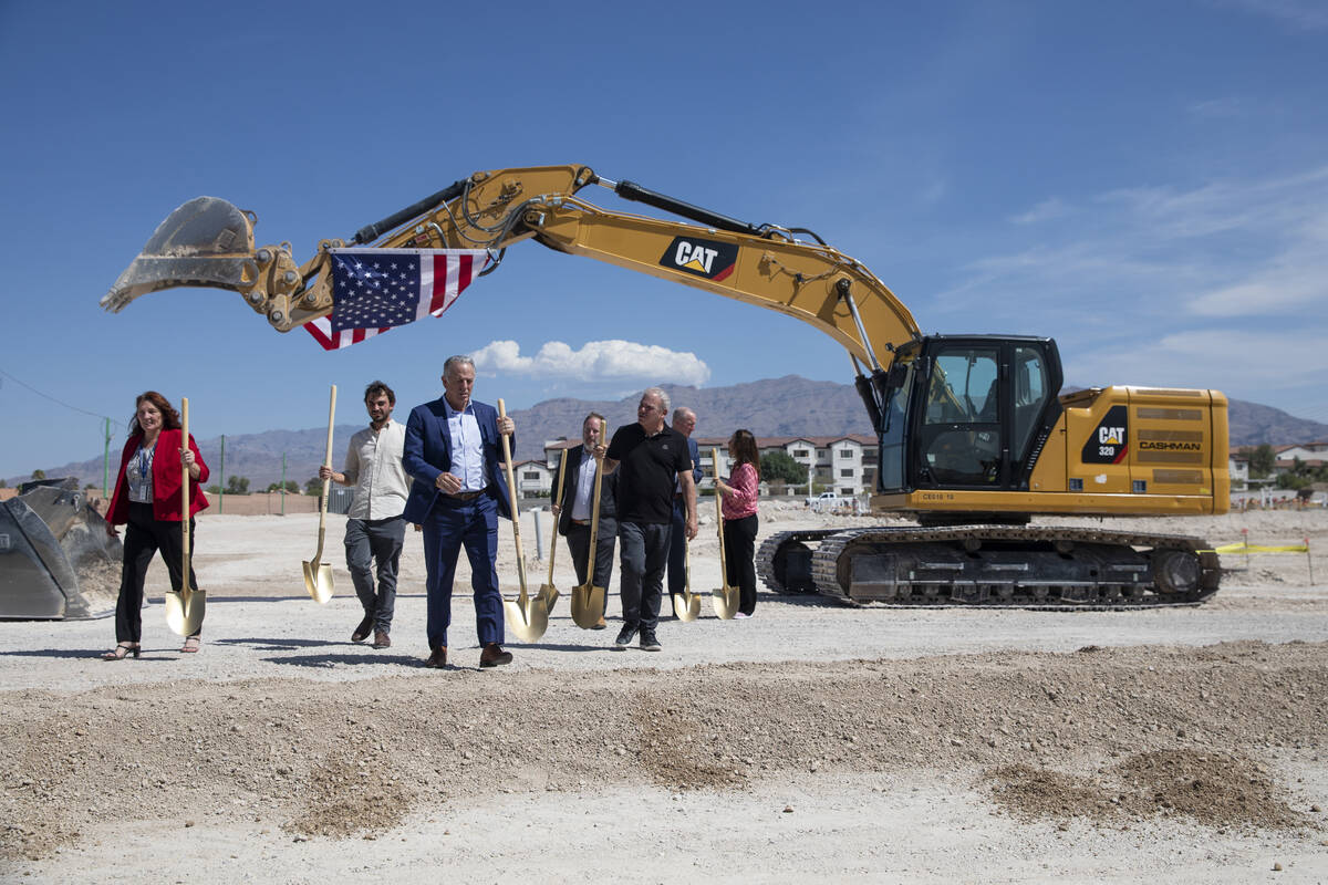 Ceremonial groundbreakers finish taking group photographs during the Ovation Development Corpor ...