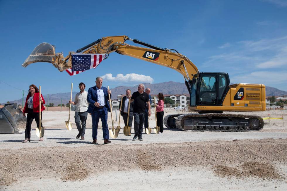 Ceremonial groundbreakers finish taking group photographs during the Ovation Development Corpor ...