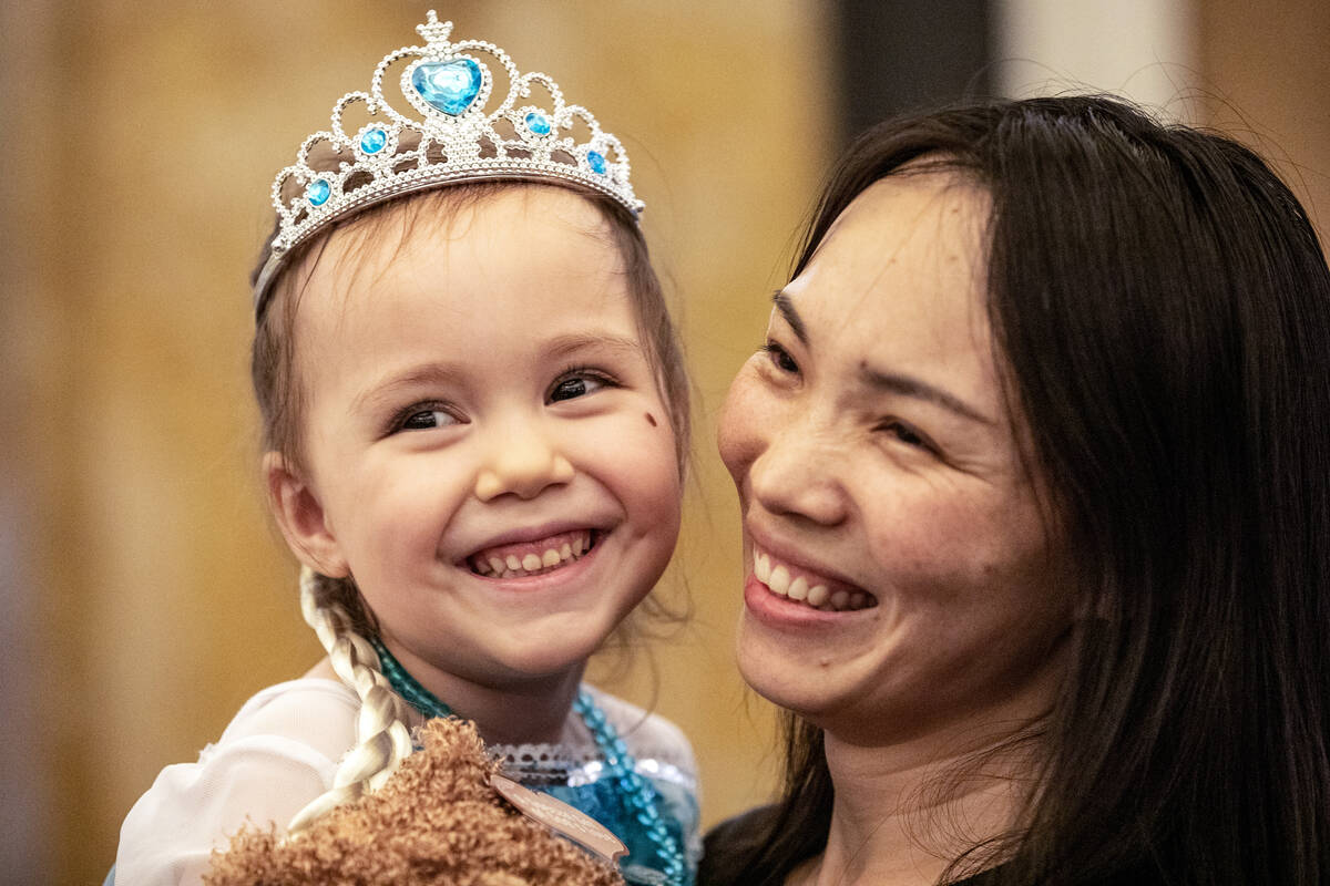 June Chen holds her daughter Samantha Buckley, 5, during a Make-A-Wish Southern Nevada trip to ...