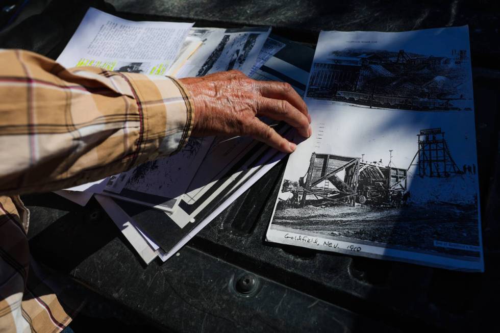 Allen Metscher sorts through historical Goldfield documents on Saturday, Aug. 3, 2024, in Goldf ...