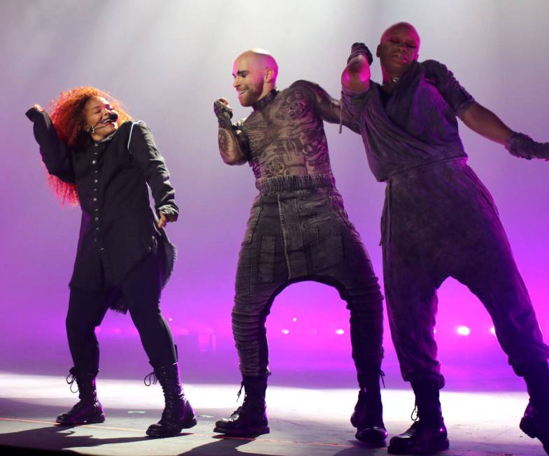 Janet Jackson (L) performs onstage during the opening night of her Metamorphosis - The Las Vega ...