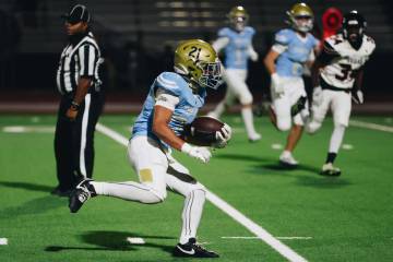 Foothill running back Avant Gates Jr. carries the ball down the field during a game against Las ...