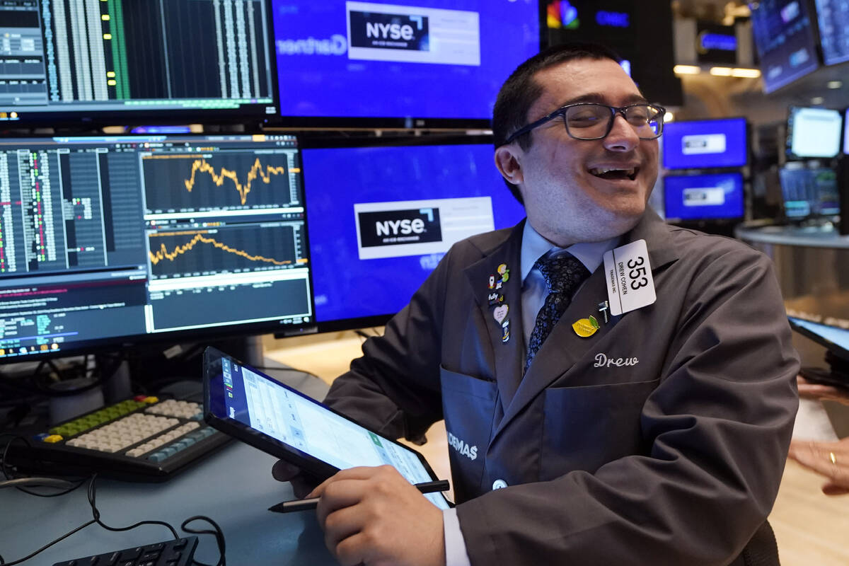 Trader Drew Cohen works on the floor of the New York Stock Exchange, Tuesday, Aug. 6, 2024.(AP ...