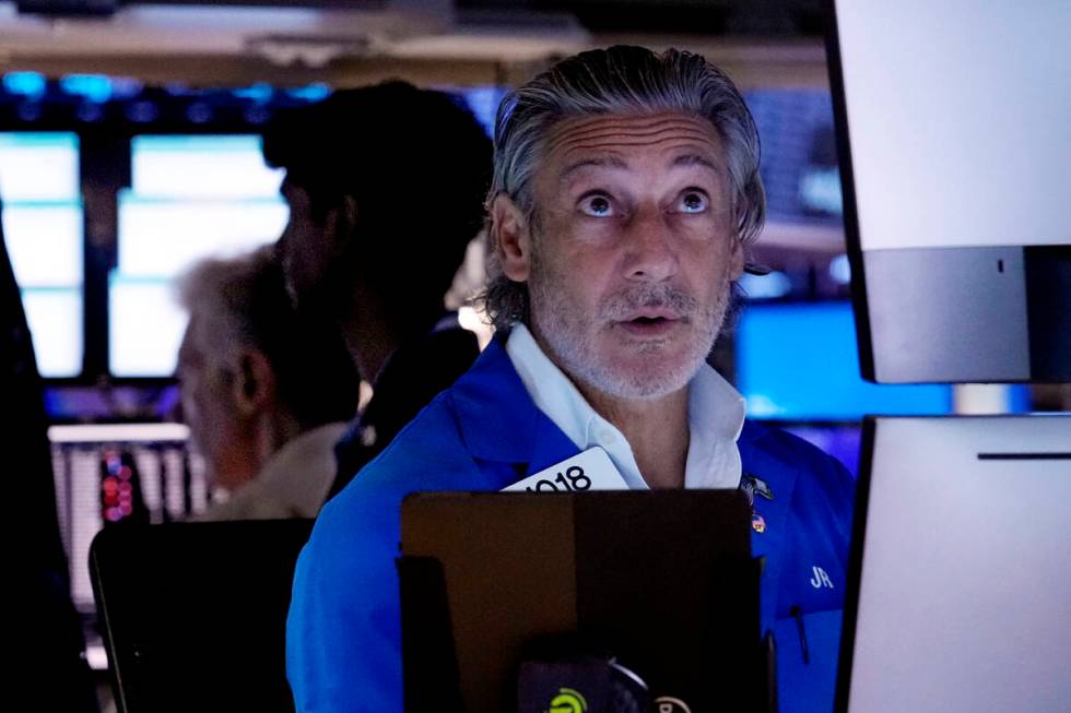 Trader John Romolo works on the floor of the New York Stock Exchange, Tuesday, Aug. 6, 2024.(AP ...