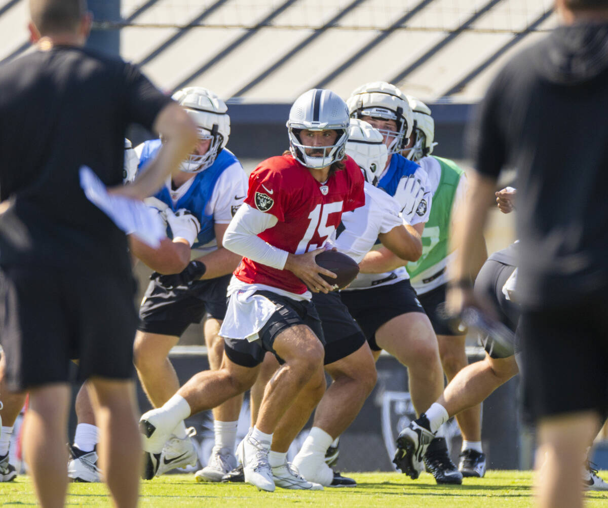 Raiders quarterback Gardner Minshew (15) drops back in the pocket during the third day of Raide ...