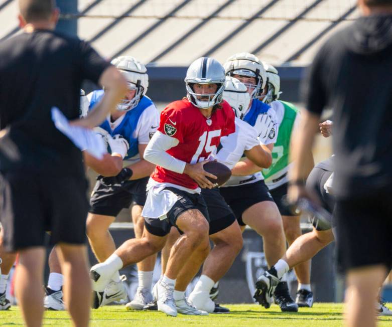 Raiders quarterback Gardner Minshew (15) drops back in the pocket during the third day of Raide ...