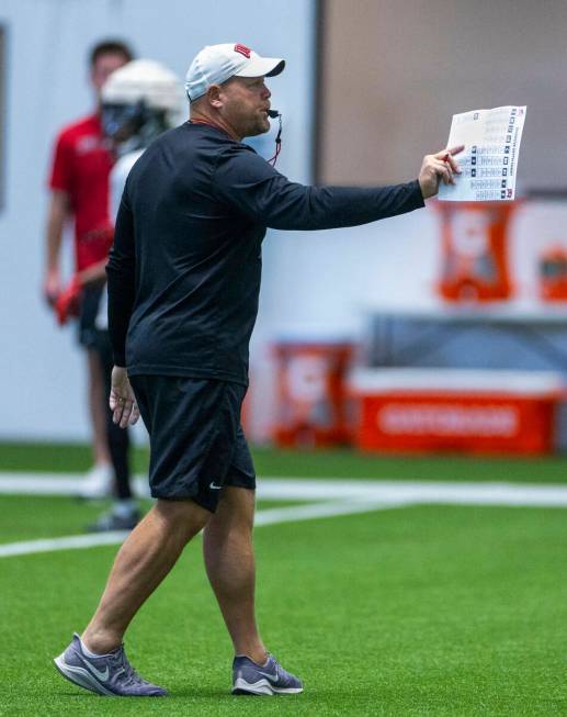 UNLV head coach Barry Odom instructs his players during football practice at the Intermountain ...