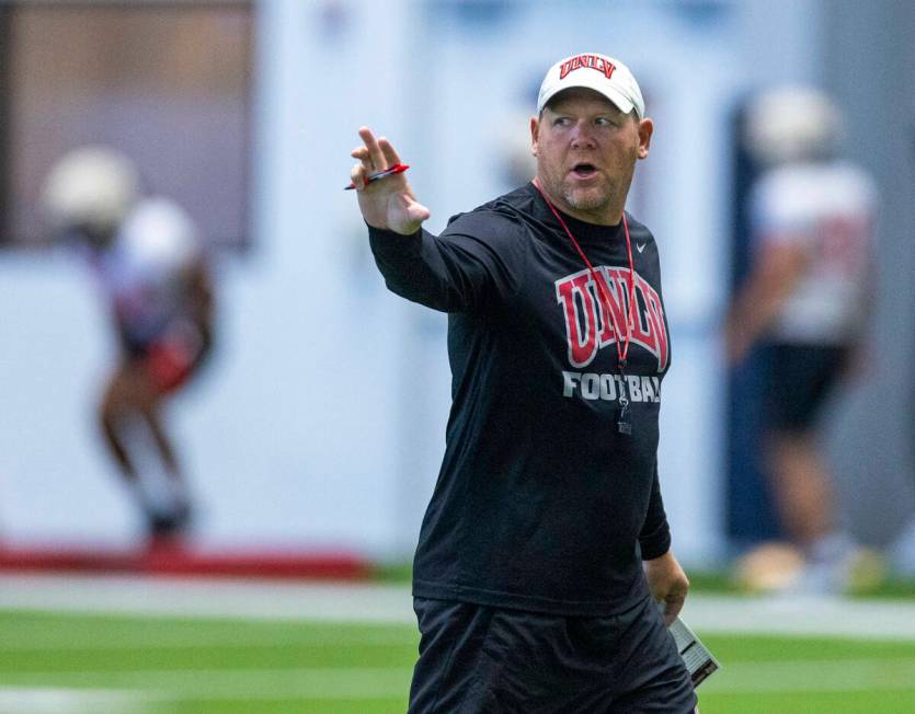 UNLV head coach Barry Odom instructs his players during football practice at the Intermountain ...