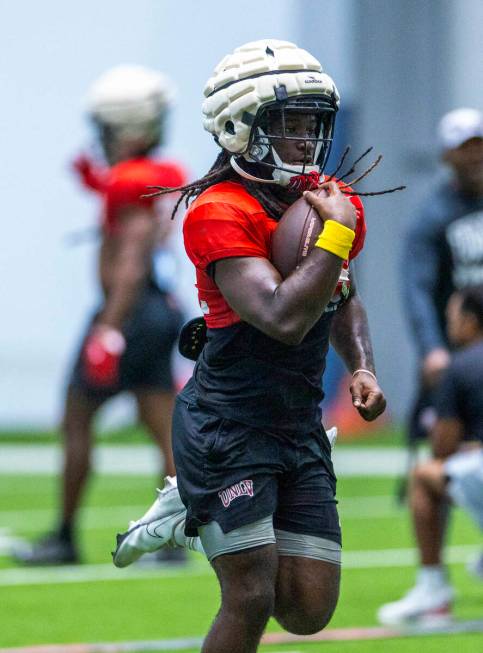 UNLV running back Devin Green (22) runs up the field during football practice at the Intermount ...