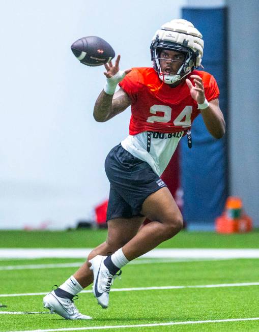 UNLV running back Darrien Jones (24) looks in a pass during football practice at the Intermount ...