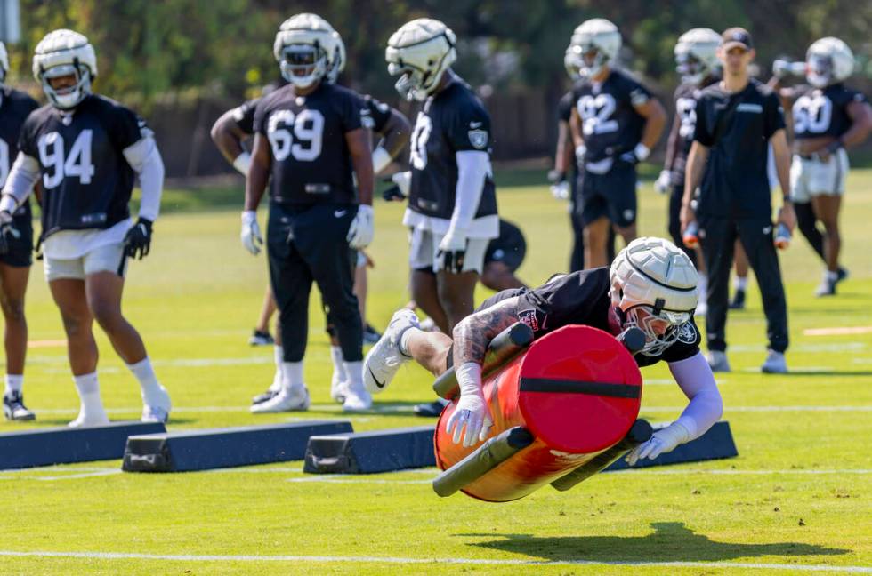 Raiders defensive end Maxx Crosby (98) tackles a dummy during the first day of Raiders training ...