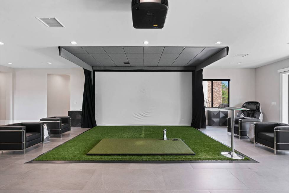 The Olympia Canyon Way home has a state-of-the-art golf simulator. (Edgar Lara, DronePixel)