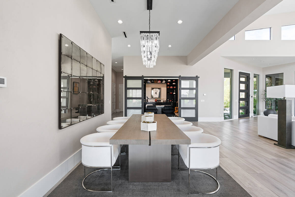 Olympia Canyon Way's formal dining room features high-end finishes and upscale furnishings. (Ed ...