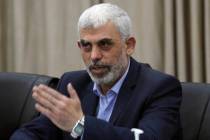 Yehia Sinwar, head of Hamas in Gaza, greets his supporters during a meeting with leaders of Pal ...