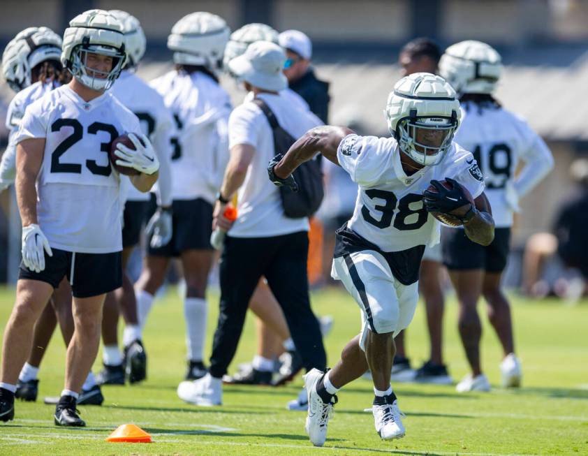 Raiders running back Brittain Brown (38) sprints up field on a drill during the second day of R ...