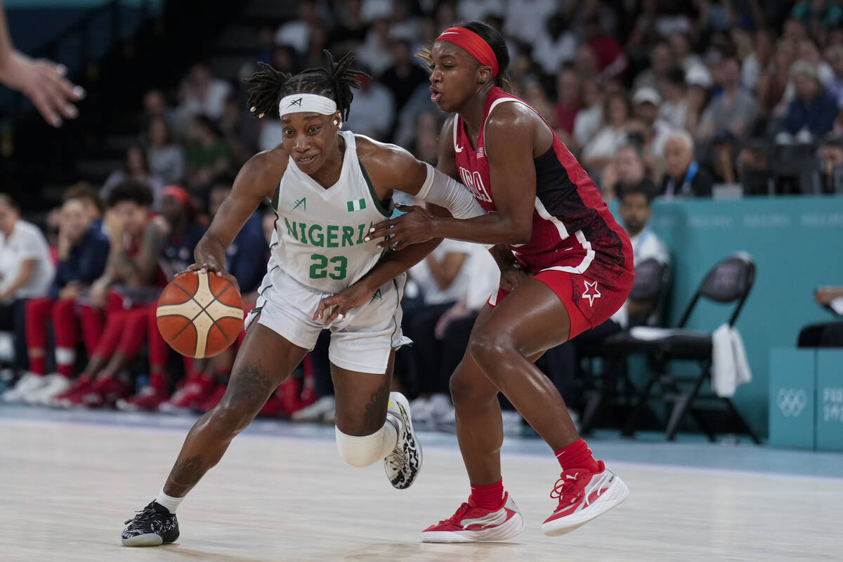 Ezinne Kalu (23), of Nigeria, drives on United States' Jackie Young (13) during a women's quart ...