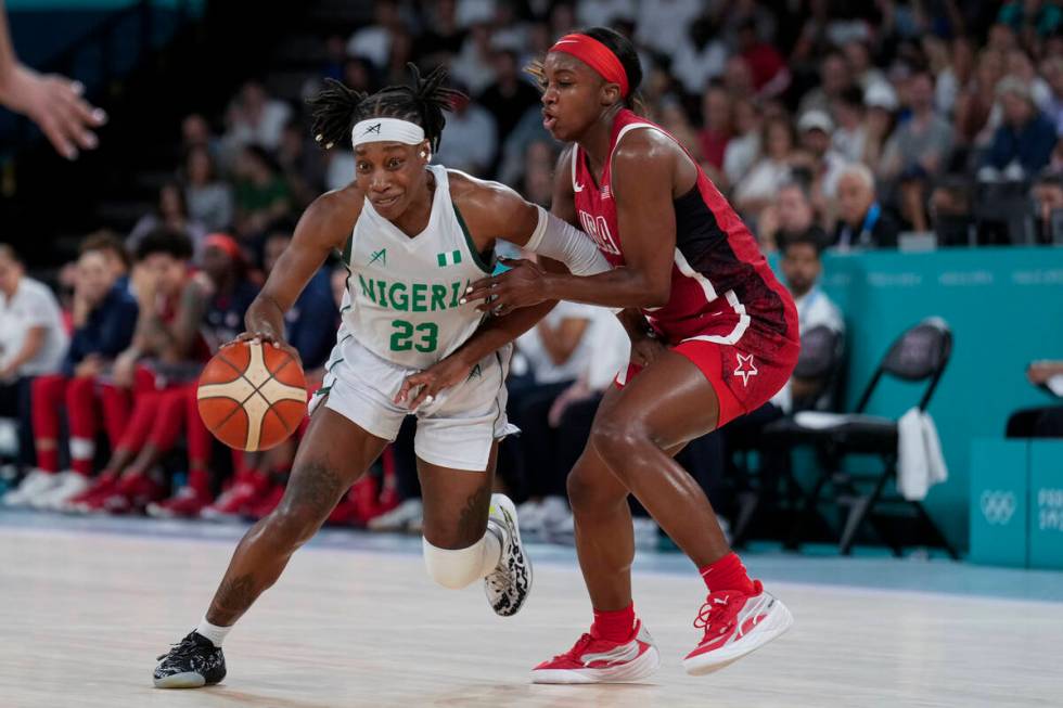 Ezinne Kalu (23), of Nigeria, drives on United States' Jackie Young (13) during a women's quart ...