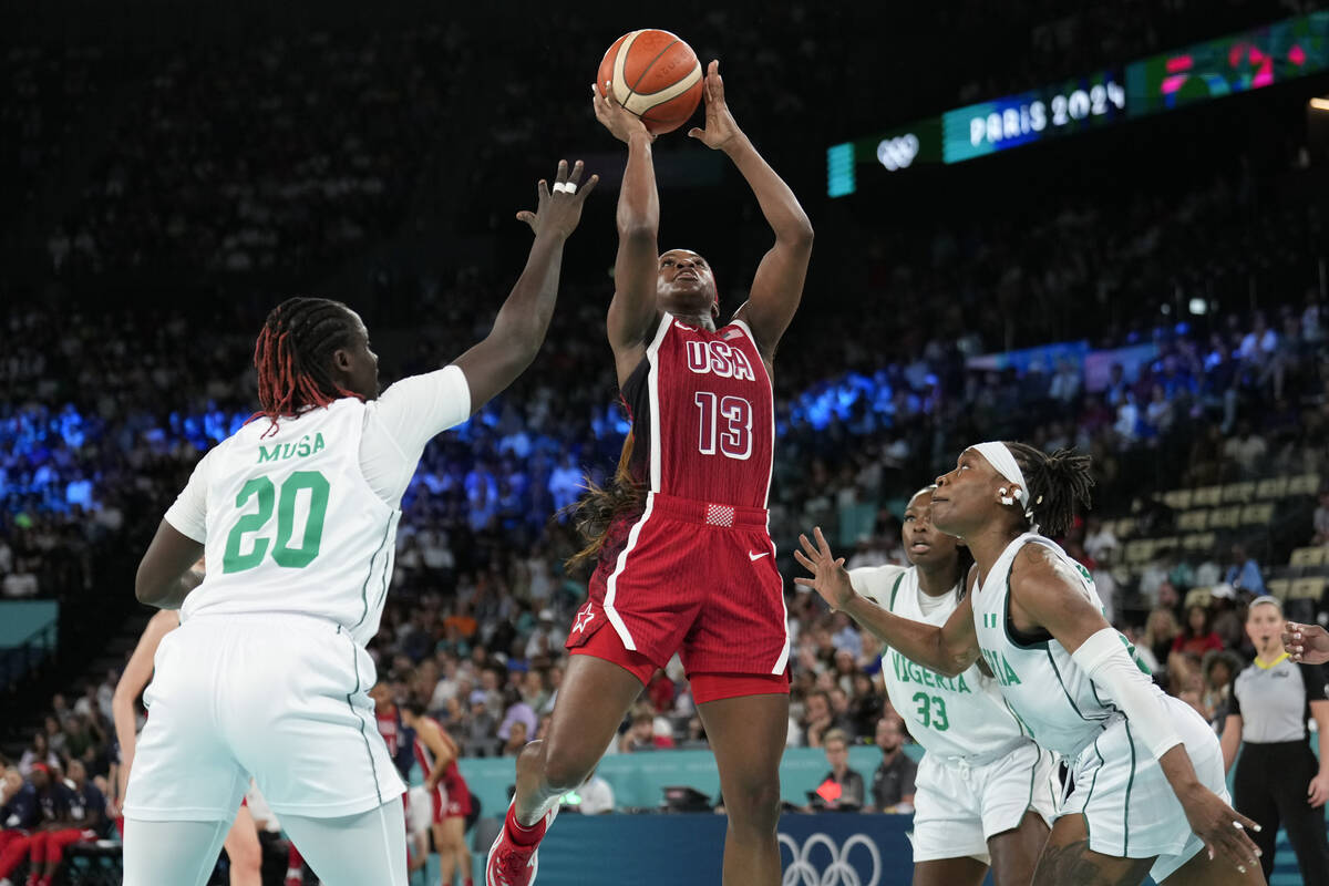 United States' Jackie Young (13) shoots between Murjanatu Musa (20) and Ezinne Kalu (23), of Ni ...