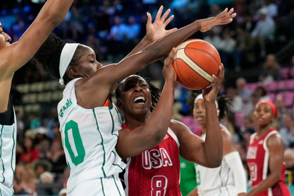 Promise Amukamara (10), of Nigeria, fouls United States' Chelsea Gray (8) during a women's quar ...