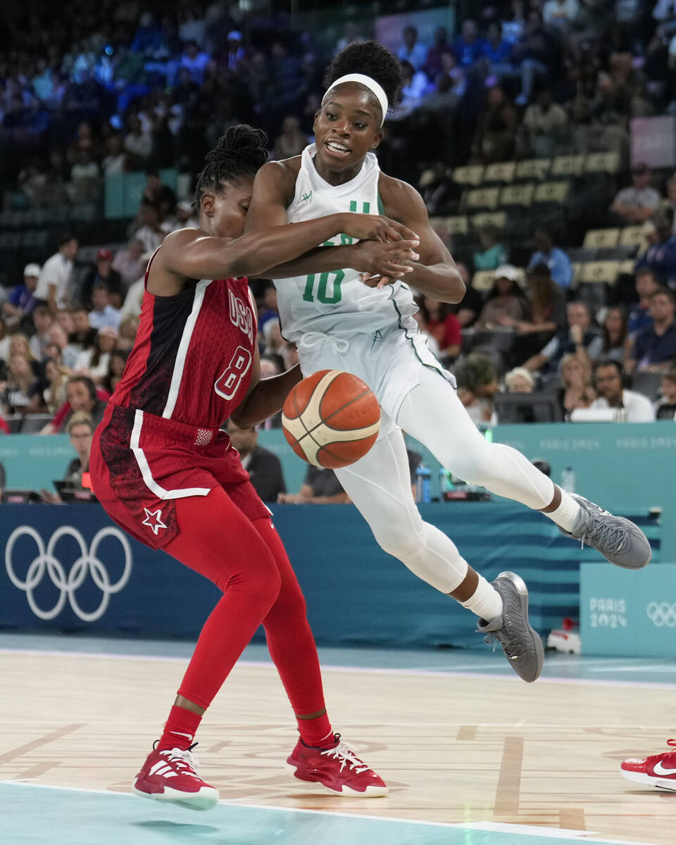 United States' Chelsea Gray (8) fouls Promise Amukamara (10), of Nigeria, during a women's quar ...