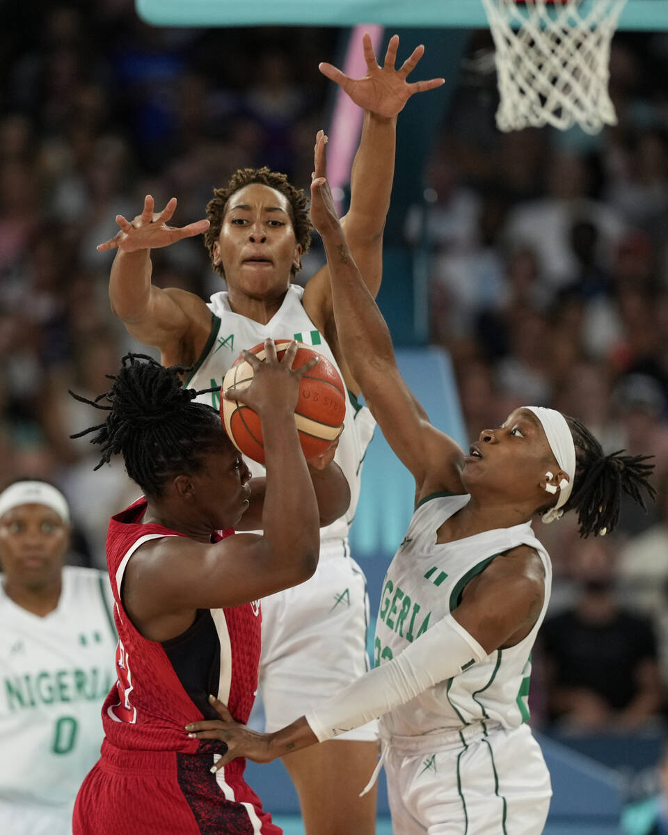 Pallas Kunayi Akpanah, left, and Ezinne Kalu (23), of Nigeria, defend United States' Chelsea Gr ...