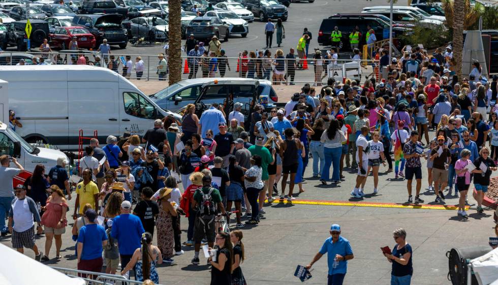 Attendees line up around the building to enter as Vice President Kamala Harris and her running ...