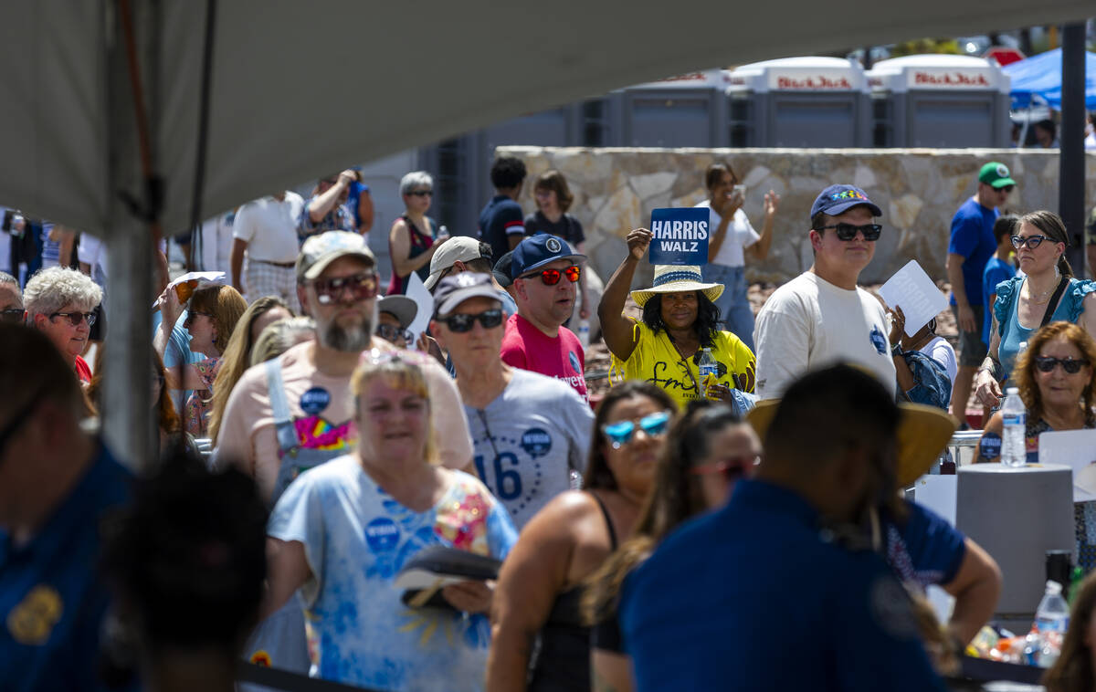 Attendees line up around the building to enter as Vice President Kamala Harris and her running ...