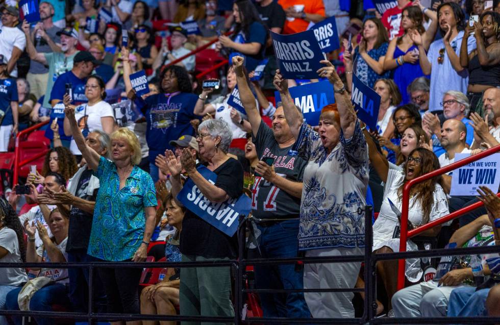 Supporters cheers as Vice President Kamala Harris speaks during a campaign rally at UNLV&#x2019 ...