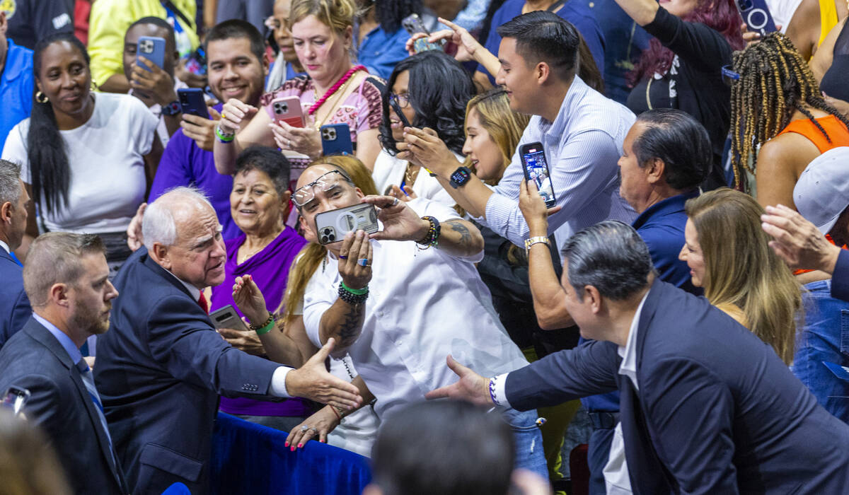 Minnesota Gov. Tim Walz greets supporters following a campaign rally at UNLV’s Thomas &a ...