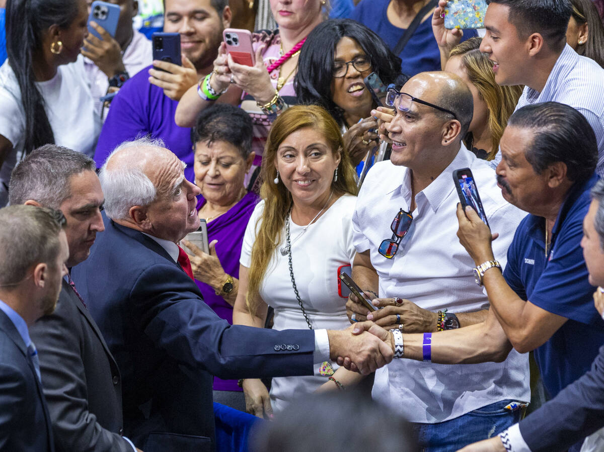 Minnesota Gov. Tim Walz greets supporters following a campaign rally at UNLV’s Thomas &a ...