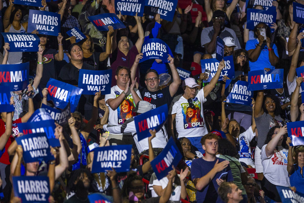 Supporters cheer as Vice President Kamala Harris speaks during a campaign rally at UNLV’ ...