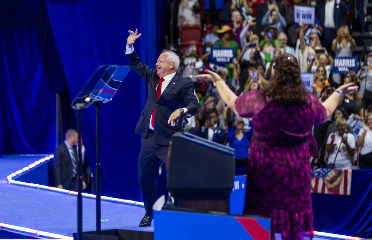 Minnesota Gov. Tim Walz, arrives on stage during a campaign rally at UNLV’s Thomas & ...