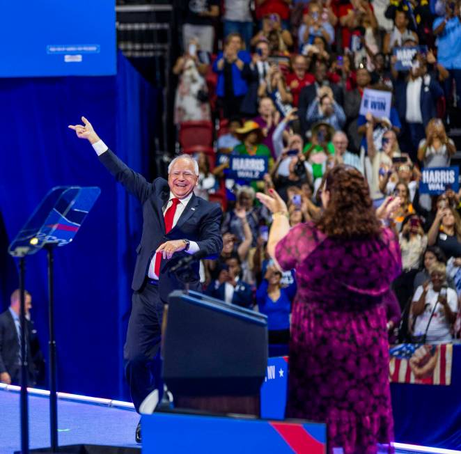 Minnesota Gov. Tim Walz, arrives on stage during a campaign rally at UNLV’s Thomas & ...