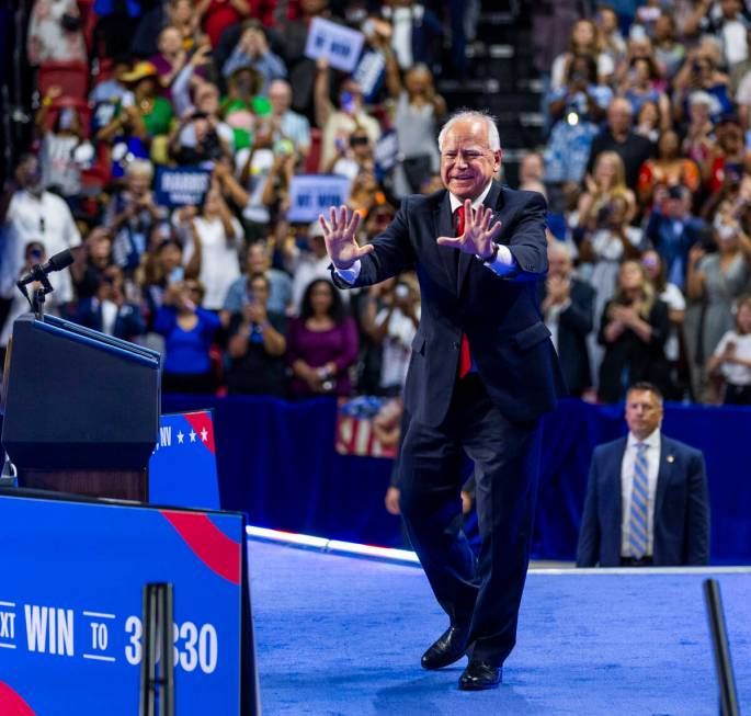 Minnesota Gov. Tim Walz, greets supporters on stage during a campaign rally at UNLV’s Th ...