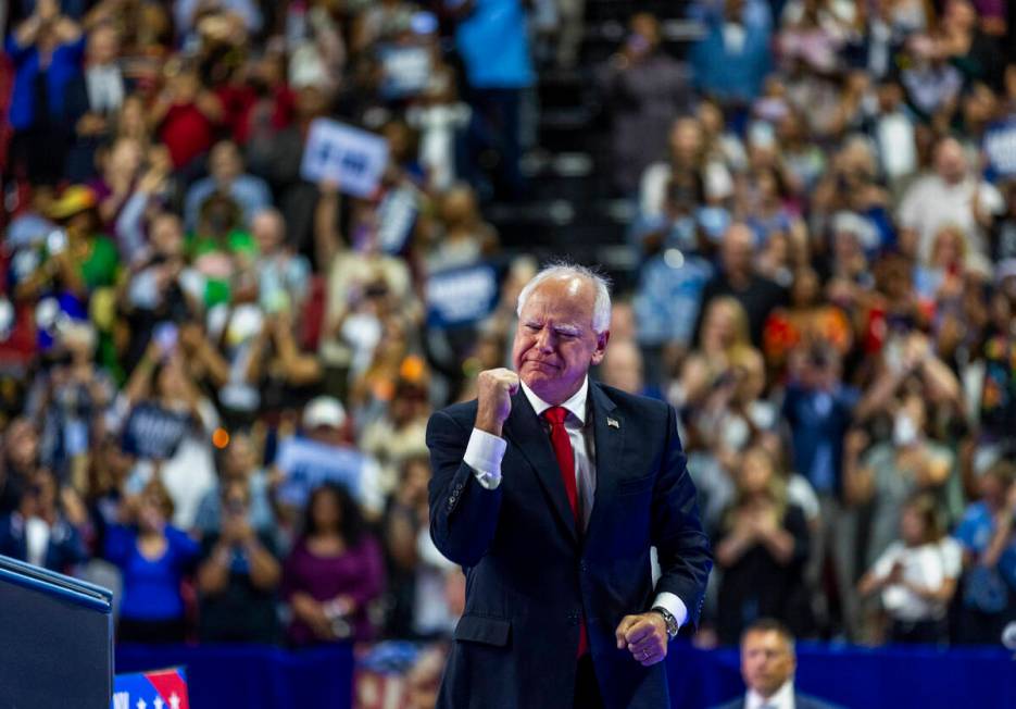 Minnesota Gov. Tim Walz, greets supporters on stage during a campaign rally at UNLV’s Th ...