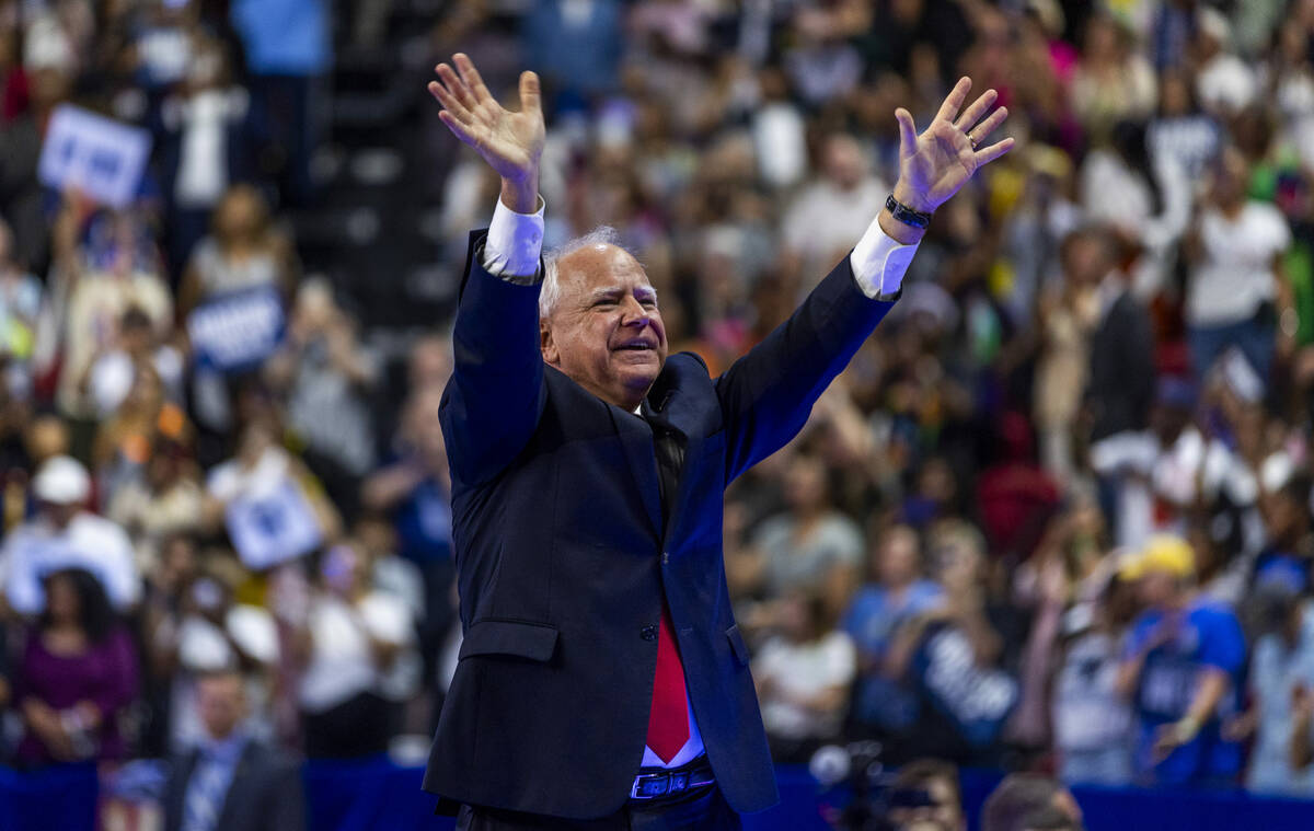 Minnesota Gov. Tim Walz, greets supporters on stage during a campaign rally at UNLV’s Th ...