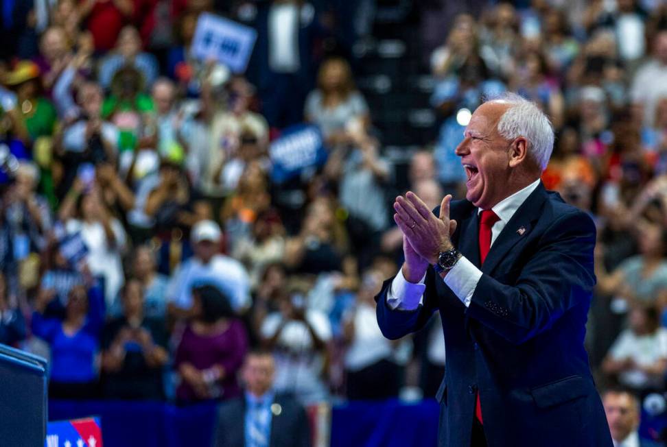 Minnesota Gov. Tim Walz, greets supporters on stage during a campaign rally at UNLV’s Th ...