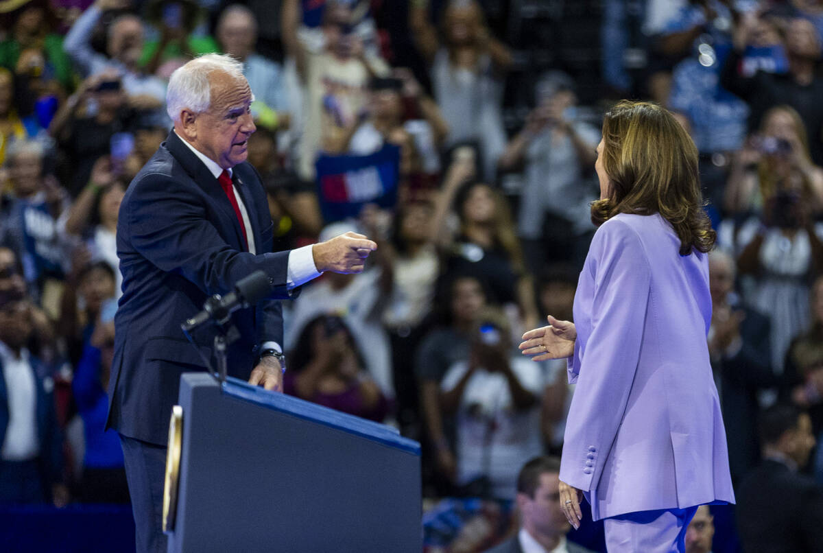 Minnesota Gov. Tim Walz says goodbye to Vice President Kamala Harris as she arrives on stage du ...