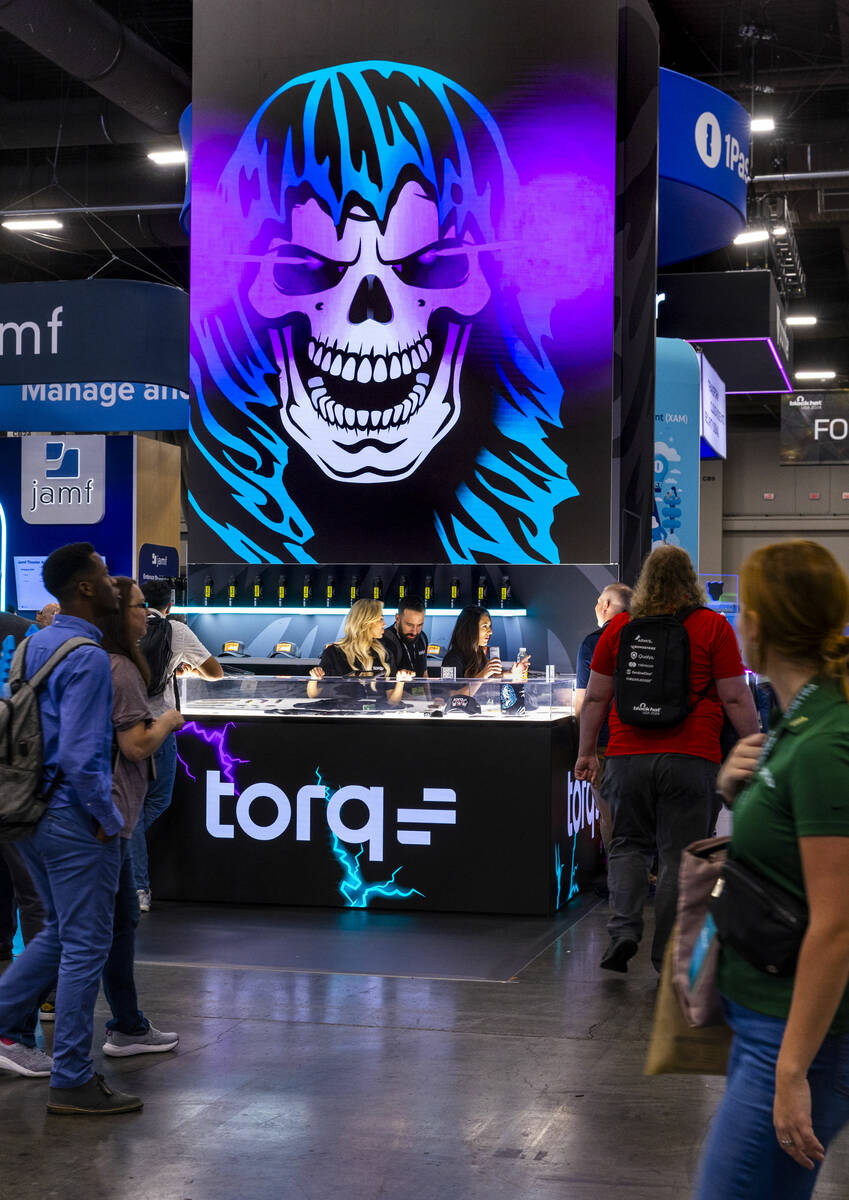 Attendees wander about the Torq display during the Black Hat convention at the Mandalay Bay on ...