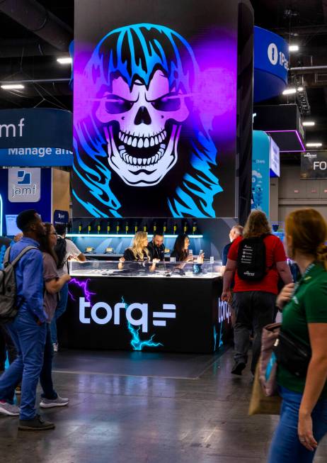 Attendees wander about the Torq display during the Black Hat convention at the Mandalay Bay on ...