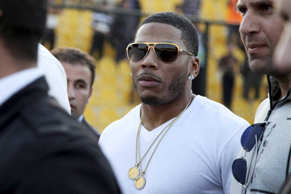 Rapper Nelly approaches the stage for a concert in Erbil, northern Iraq, March 13, 2015. (AP Ph ...