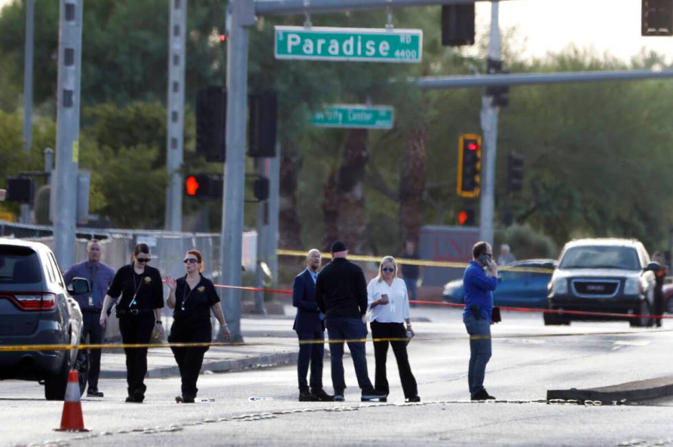 Las Vegas police investigate a shooting involving an officer in the area of East Harmon Avenue ...