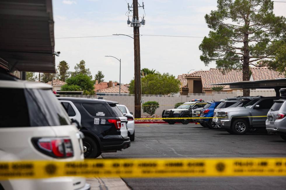 Police at the scene where one person died after a shooting at an apartment complex in west Las ...