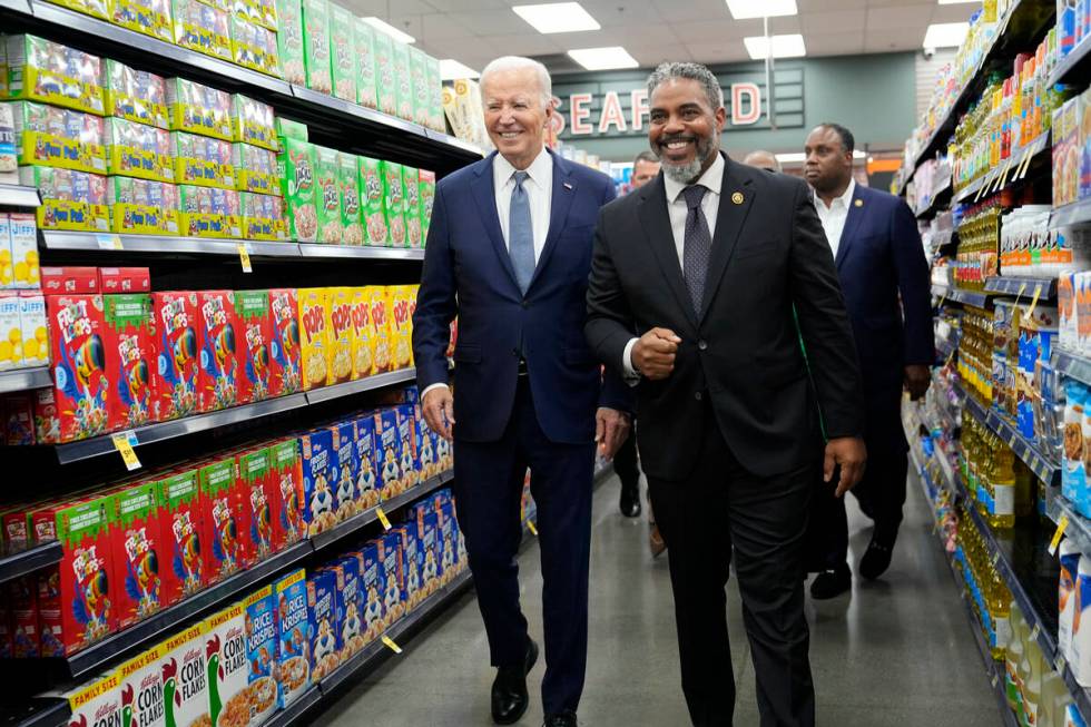 President Joe Biden walks with Rep. Steve Horsford, D-Nev., as he visits Mario's Westside Marke ...