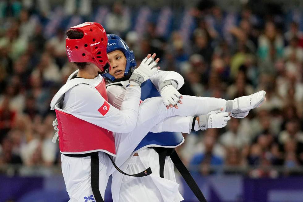 United States' Faith Dillon (in blue) competes with Tunisia's Chaima Toumi in a women's 57kg Ta ...