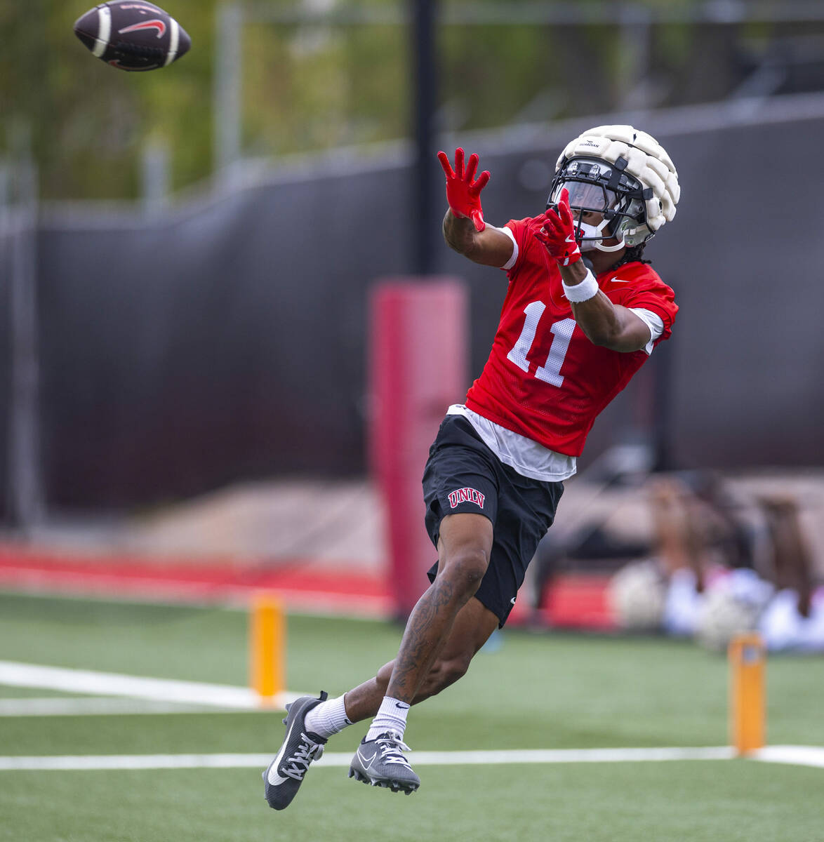 UNLV wide receiver Ricky White III (11) elevates to make a catch during the first day of footba ...