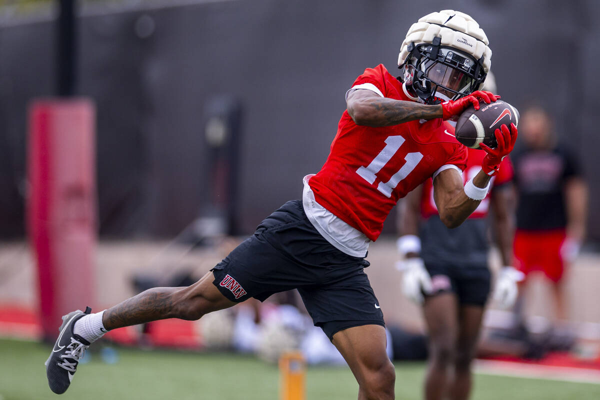 UNLV wide receiver Ricky White III (11) secures a catch during the first day of football practi ...