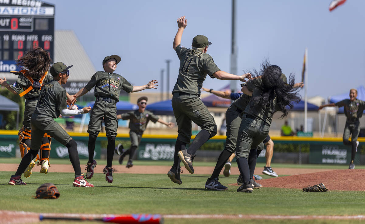 Nevada players celebrate their 2-0 win over Utah in the Mountain Regional final baseball game o ...